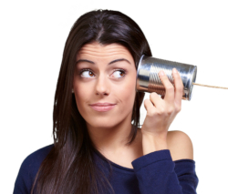 Photo of a woman listening through a tin-can "phone"