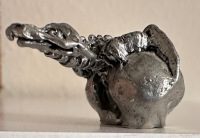 Photo of a little pewter dragon.