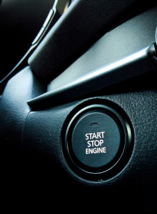 Closeup photo of a car's power button.