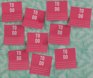 Ten hot-pink sticky notes with the words TO DO in white at the top, stuck somewhat randomly to a light green patterned background.