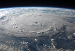 Photograph of a hurricane cloud-swirl from above.